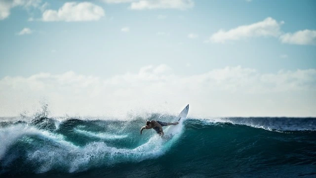 surf in playa venao person surfing up a wave