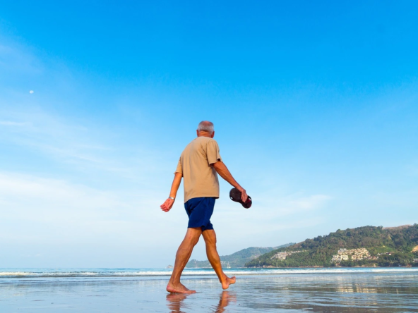 retiring in panama senior man walking on beach