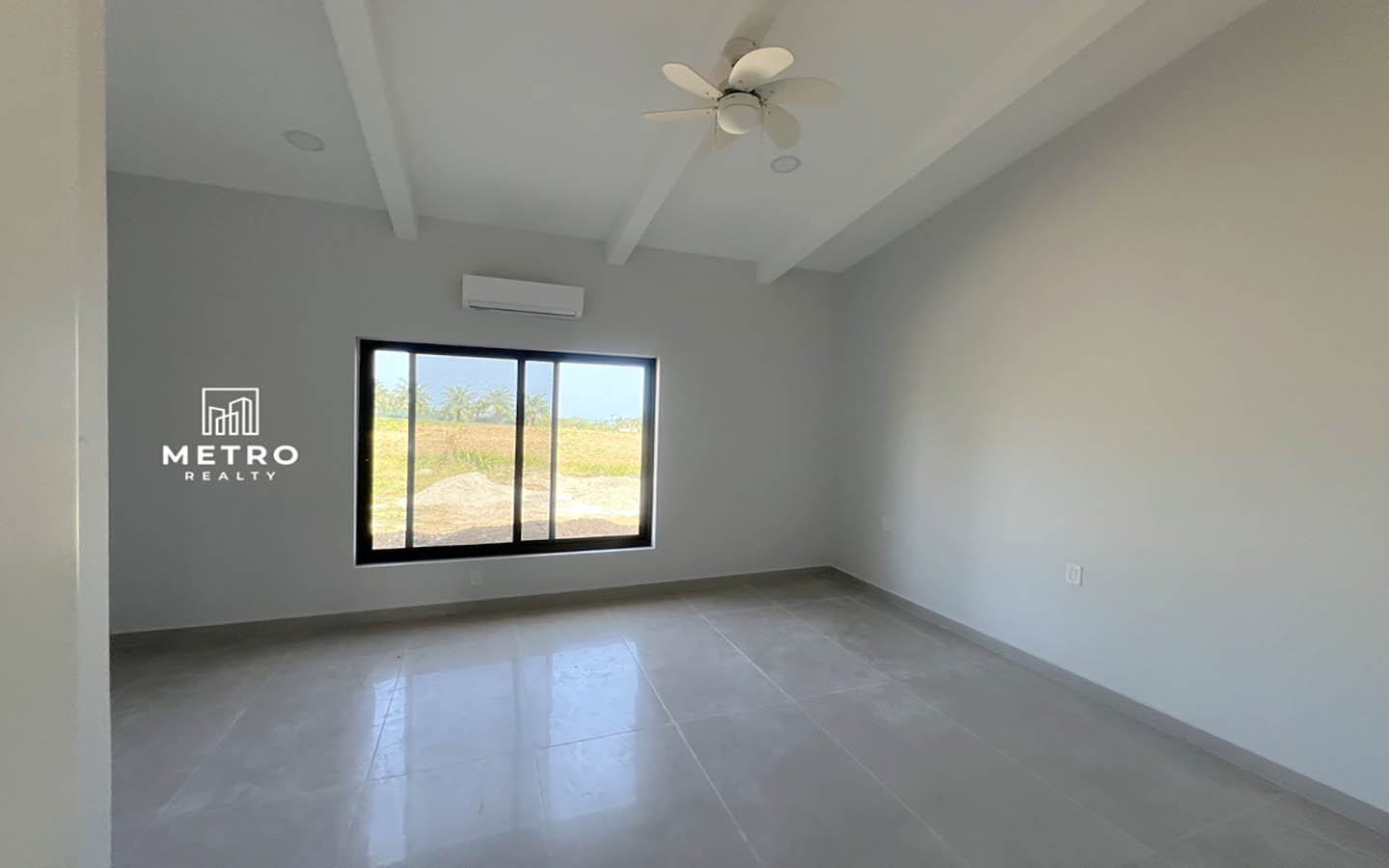 Andromeda Pedasi house for sale bedroom window yellow house bedroom