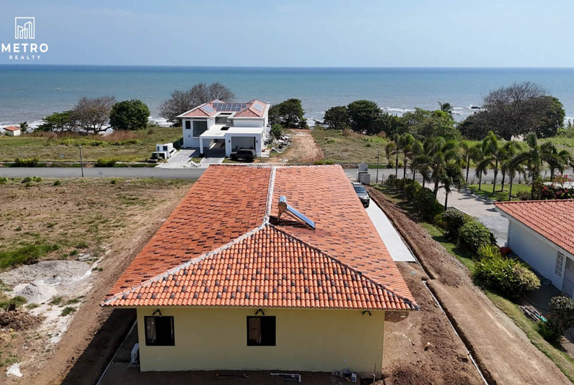 Andromeda Pedasi house for sale yellow house
