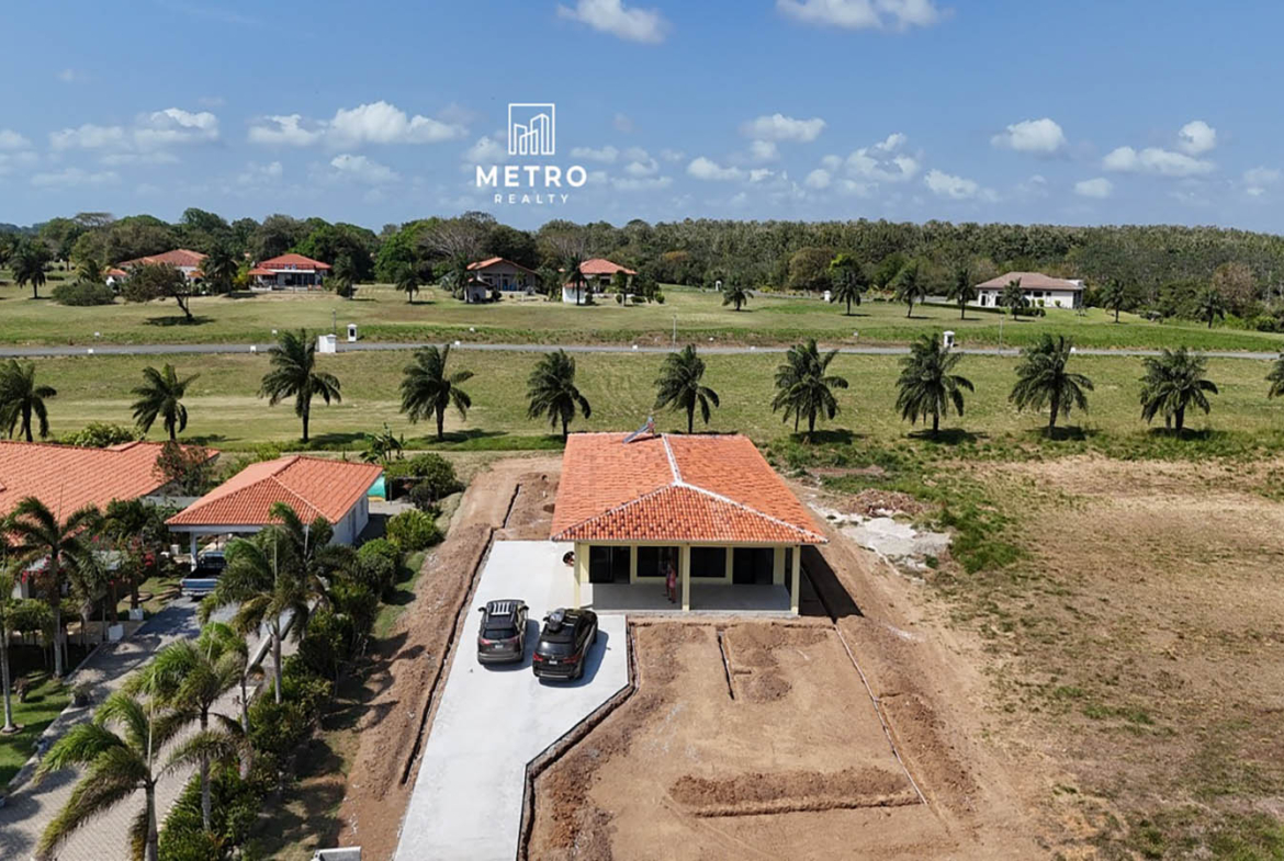 Andromeda Pedasi house for sale yellow house with parking