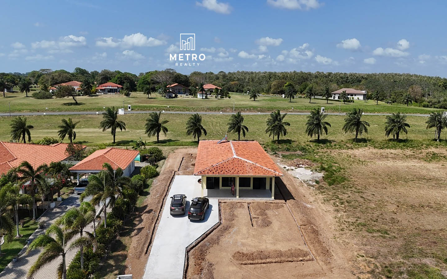 Andromeda Pedasi house for sale yellow house with parking