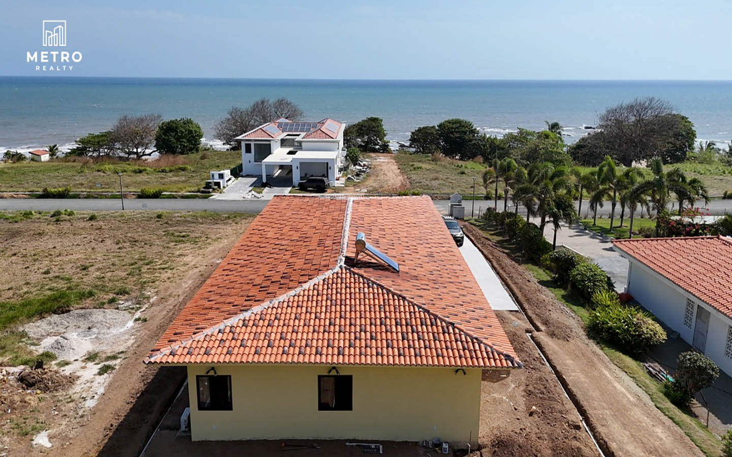 Andromeda Pedasi house for sale yellow house